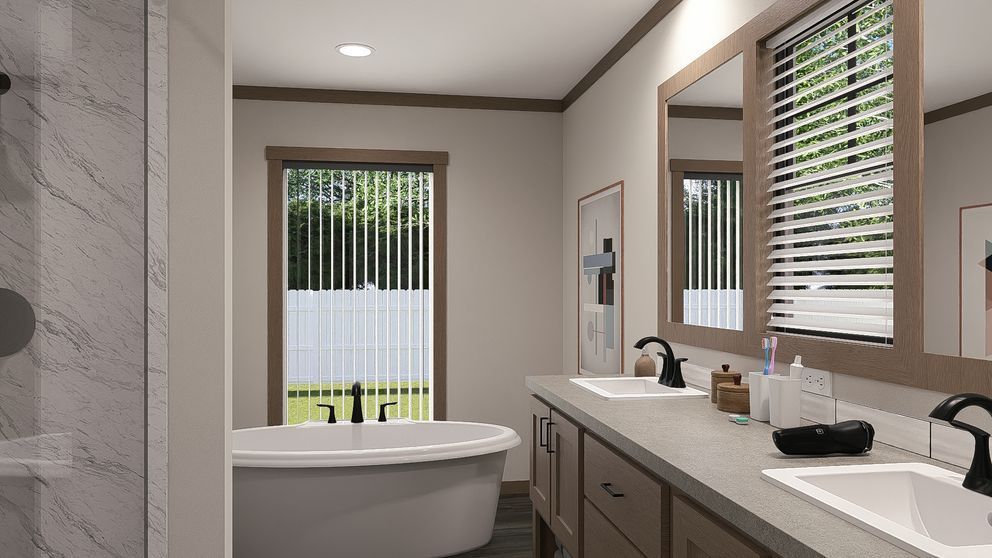 Modern bathroom with double vanity, freestanding tub, and large windows with blinds.