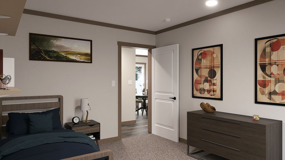Modern bedroom with dark bed, dresser, wall art, and open door to a hallway