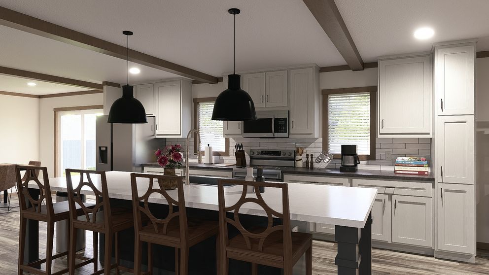 Modern kitchen and dining area with white cabinets, dark pendant lights, and a table with chairs