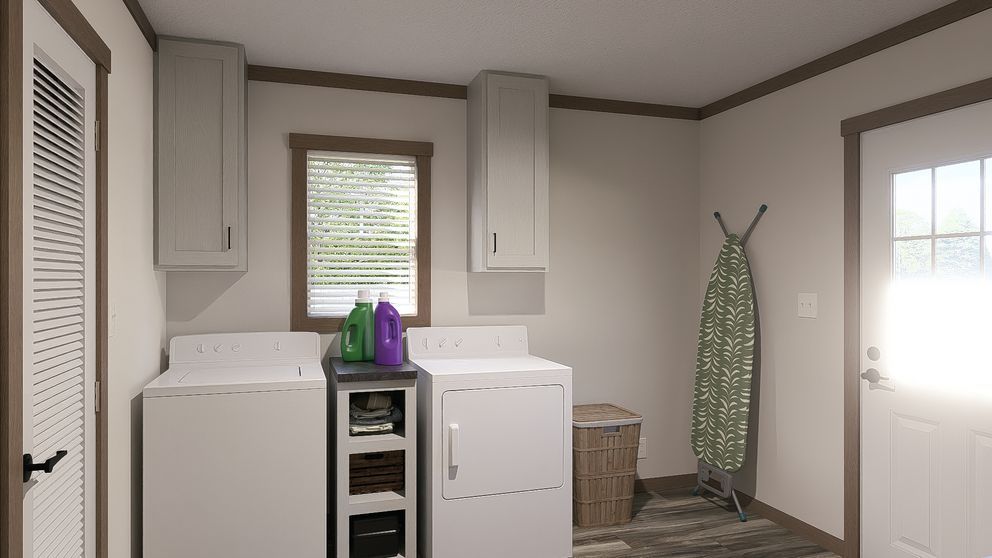 Laundry room with washer, dryer, sink, hanging clothes rack, and bright windowed door