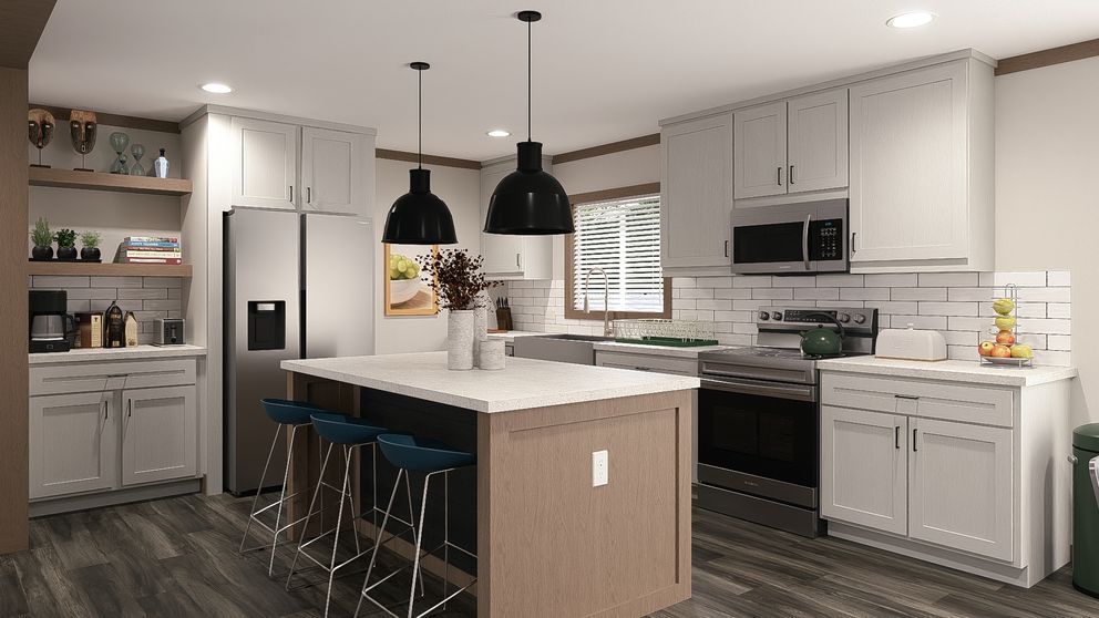 Modern white kitchen with island, black pendant lights, stainless appliances, and dark wood floors