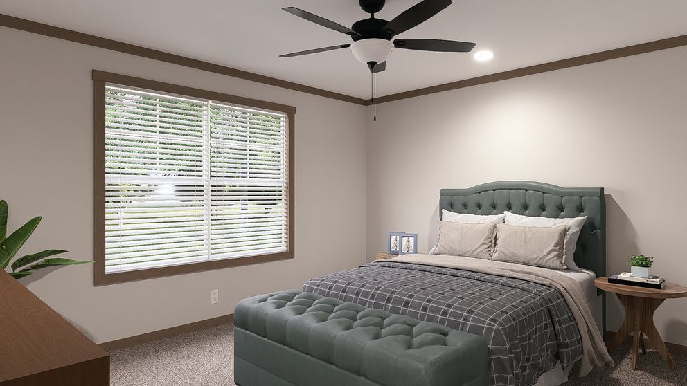 Bedroom with a tufted bed, gray bedding, ceiling fan, window blinds, and a small nightstand.