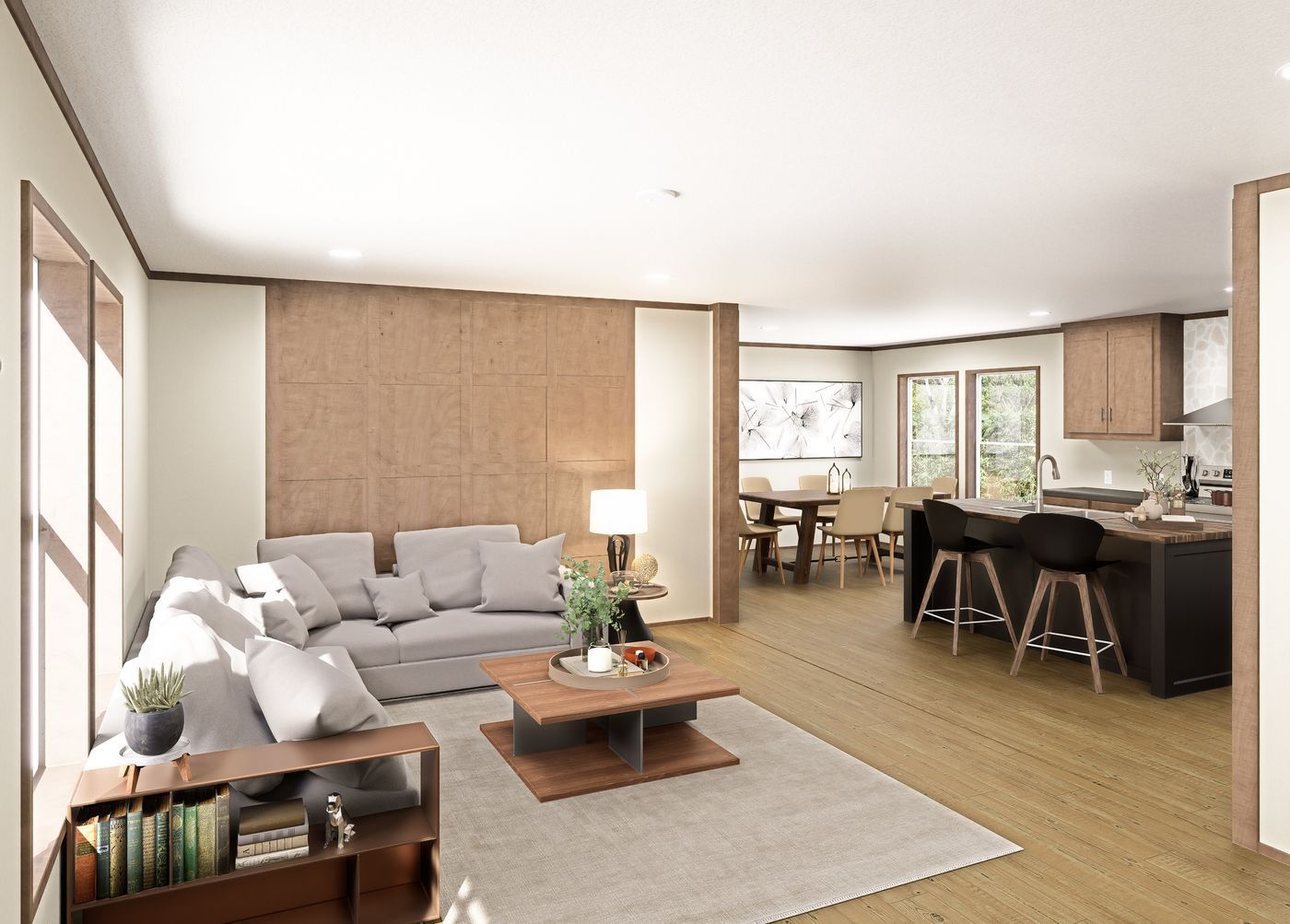 Bright open-plan living room with gray sofa, wood coffee table, and kitchen with black island stools