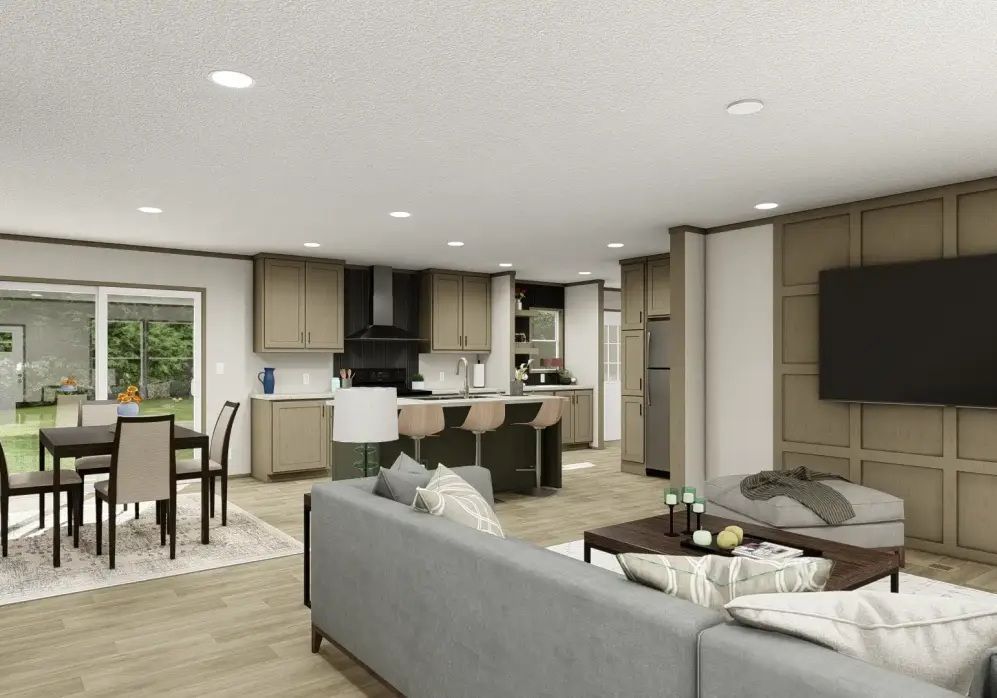 Open-plan living room and kitchen with gray sofa, dining table, and wall-mounted TV