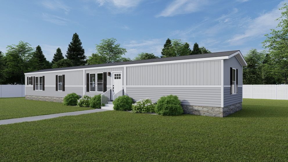 Single-story white modular home with gray trim and green lawn under a blue sky