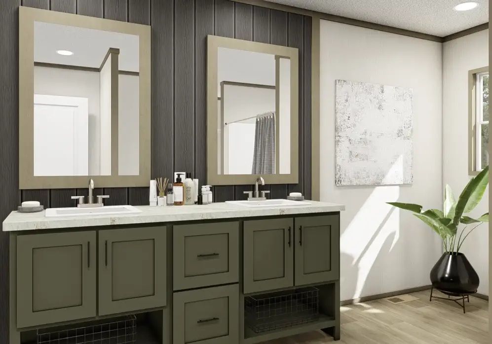 Modern bathroom vanity with double mirrors, olive cabinets, and a potted plant by the window.