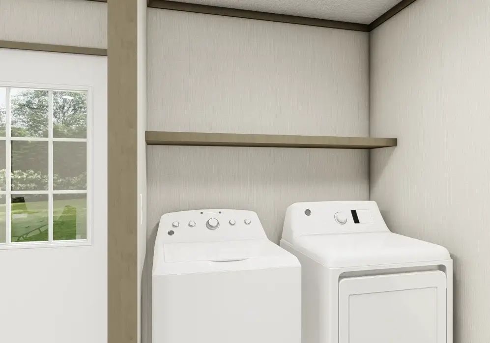 Laundry room with white washer and dryer, window, and empty shelves