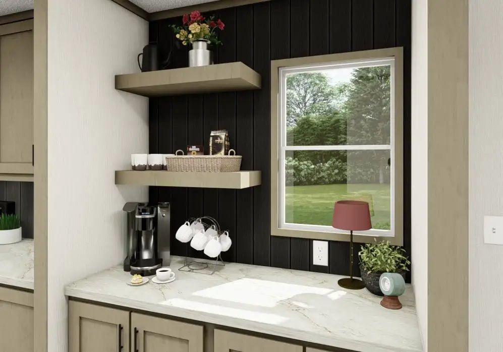 Compact kitchen nook with white countertop, black backsplash, floating shelves, coffee maker, and window.