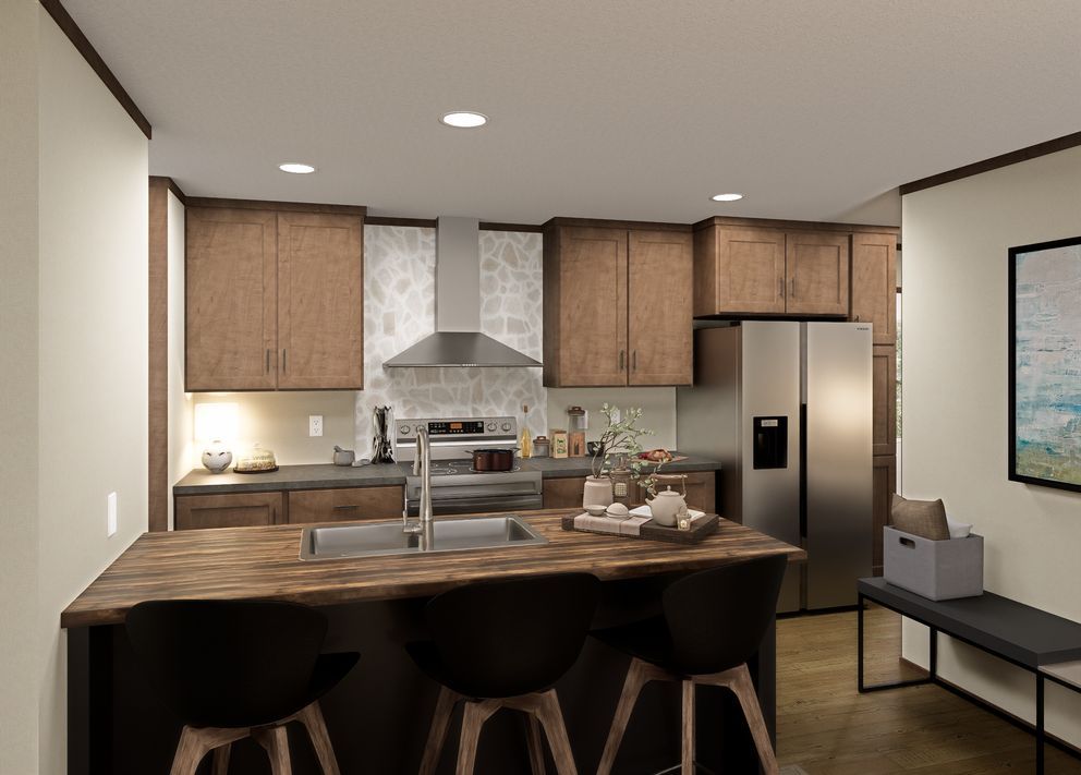 Modern kitchen with wood cabinets, stainless appliances, and a large island with stools