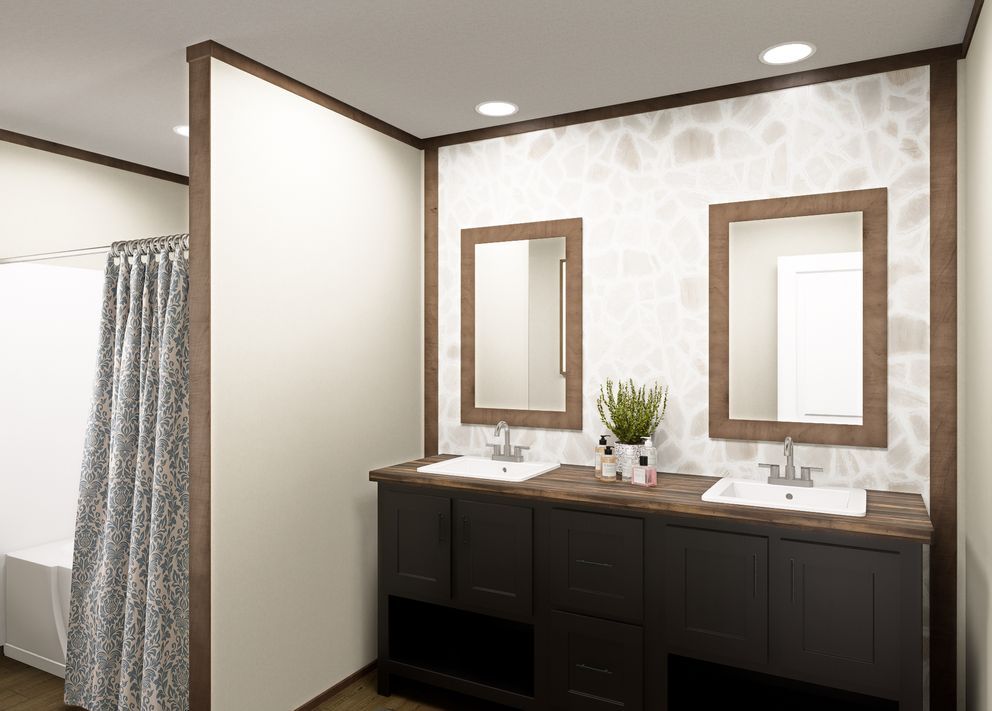 Modern bathroom vanity with double sinks, two mirrors, dark cabinets, and recessed ceiling lights.