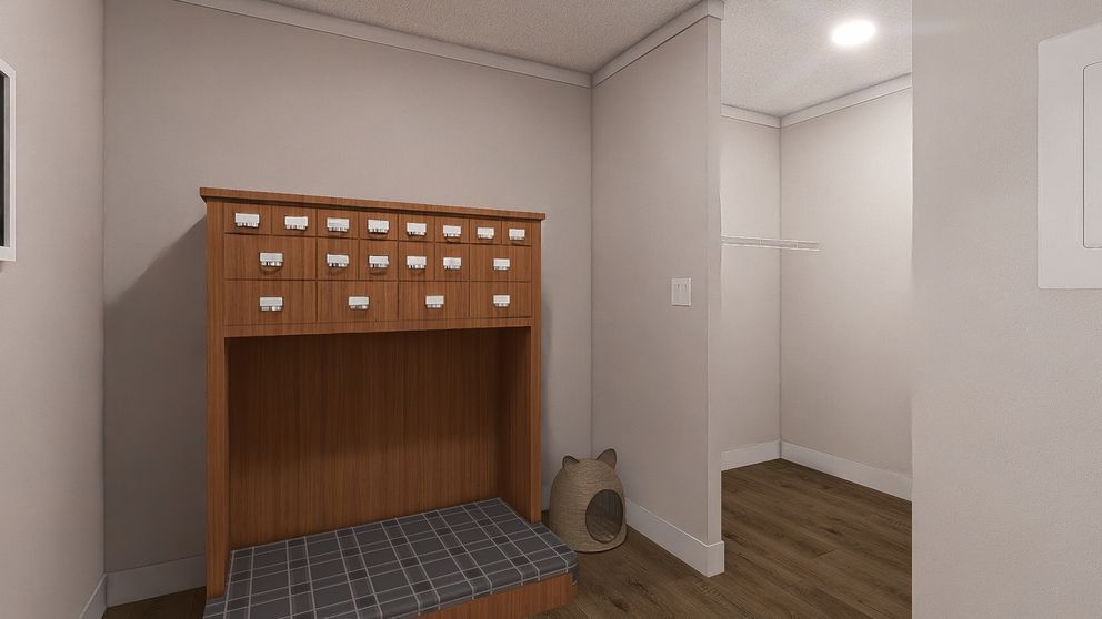 Small entryway with a wooden mail cubby, coat nook, and a pet bowl on the floor.
