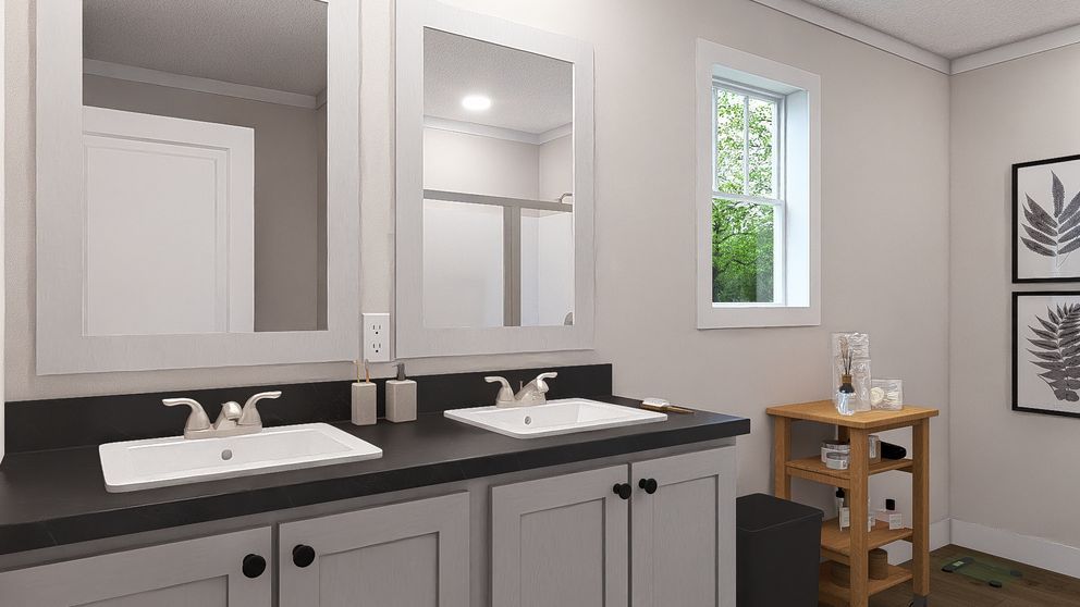Modern bathroom vanity with double sinks, large mirrors, white walls, and a small wooden shelf by the window
