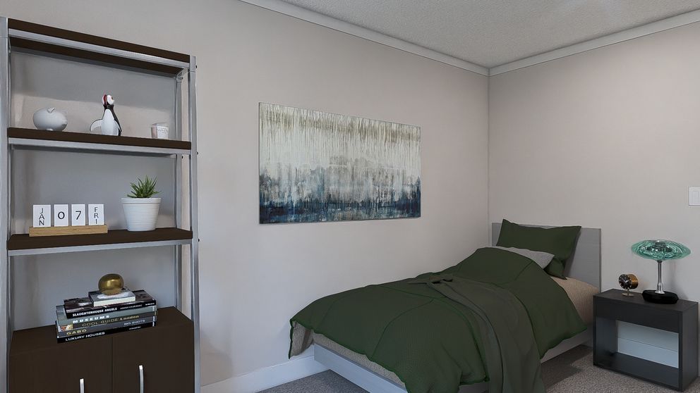 Small bedroom with a dark green bed, wall art, shelving unit, and bedside table.