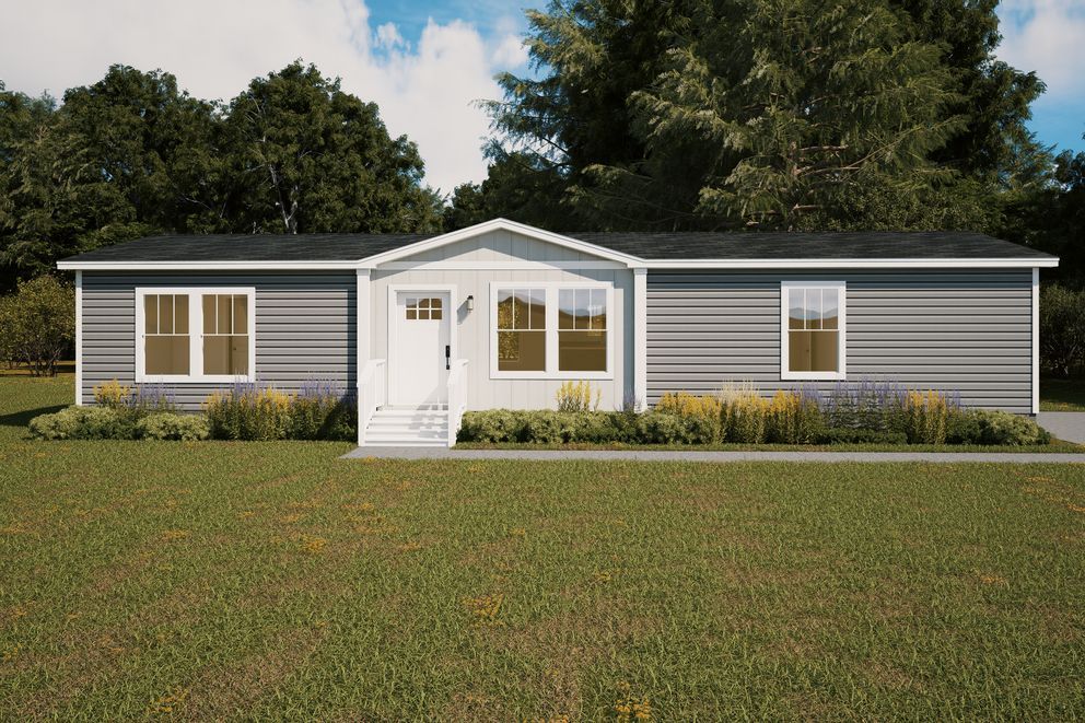 Single-story gray house with white trim, front porch, and a large green lawn under a blue sky.