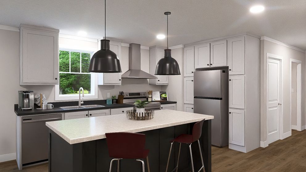 Bright modern kitchen with white cabinets, large island, black pendant lights, and stainless steel appliances