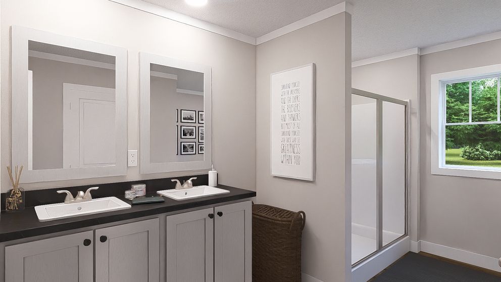 Modern bathroom with double vanity, mirrors, and a shower near a window.