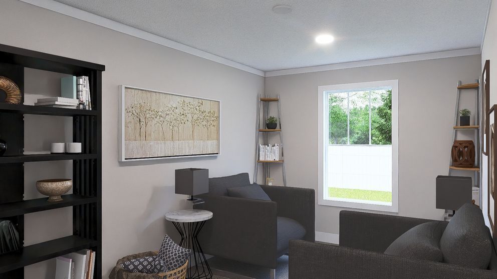 Modern living room with gray chairs, black shelving, wall art, and a bright window.