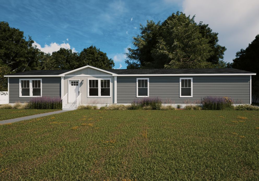 Single-story gray house with white trim and a front porch, set behind a grassy yard under a blue sky