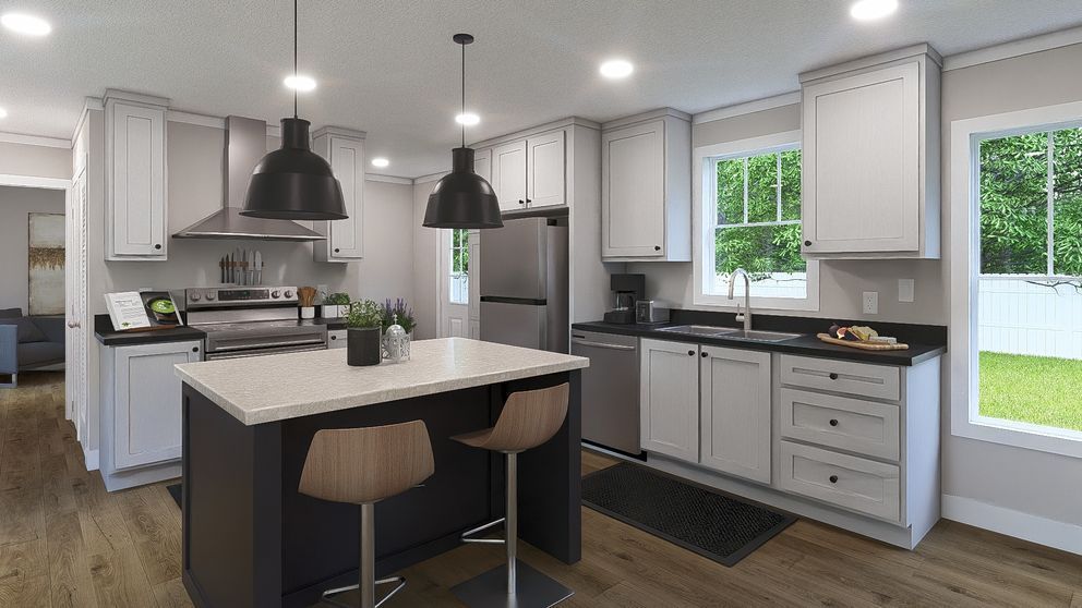 Bright modern kitchen with island, black pendant lights, white cabinets, and stainless steel appliances.