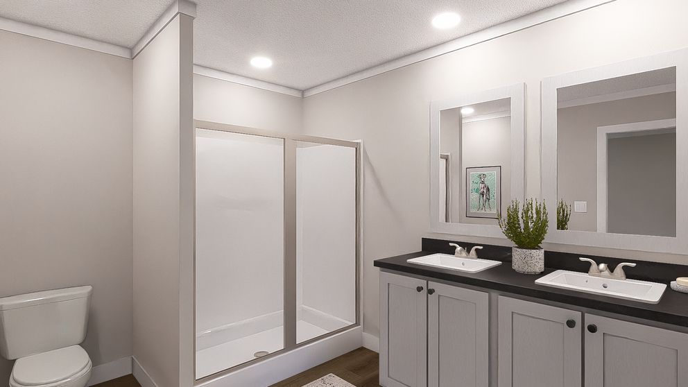 Modern bathroom with double vanity, large mirror, and walk-in shower in light neutral tones
