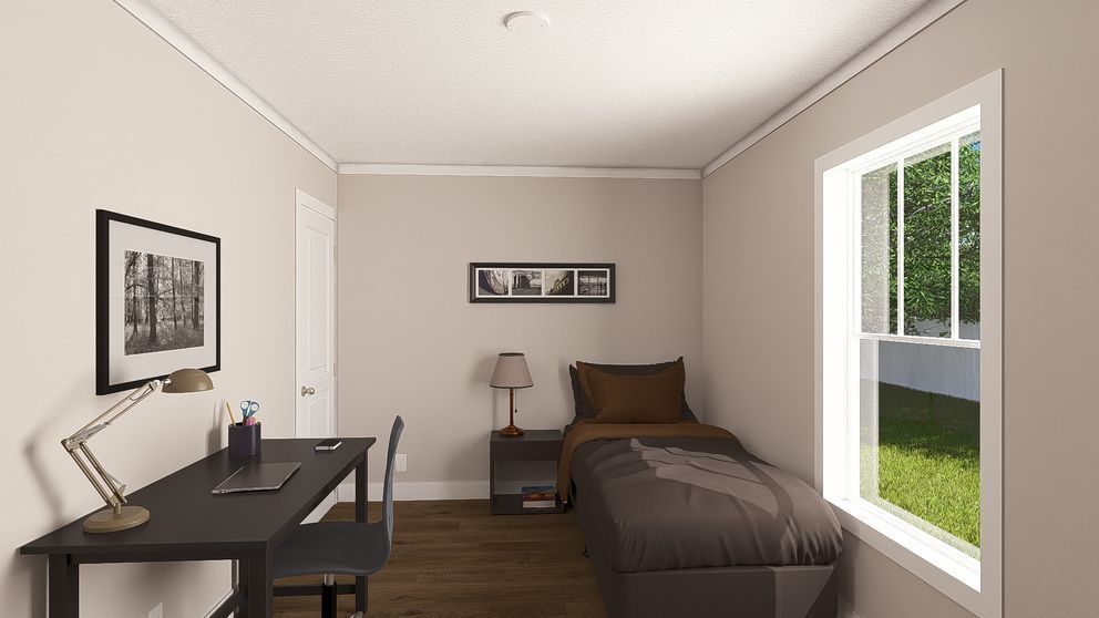 Minimal bedroom with single bed, desk, lamp, wall art, and window looking onto green yard.