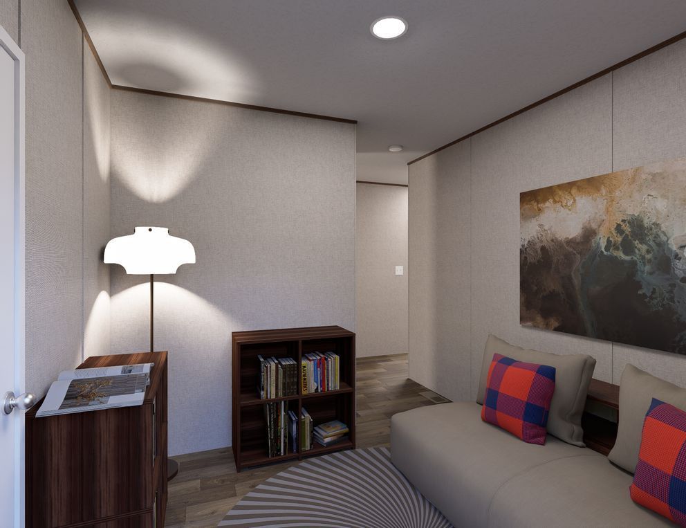 Cozy living room with sofa, floor lamp, bookshelves, striped rug, and wall art.