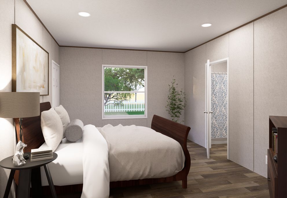 Modern bedroom with a dark wood bed, white bedding, bedside lamp, window, and closet doors