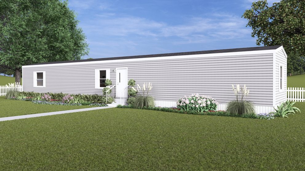 White single-story house with a small front porch, green lawn, and trees under a blue sky