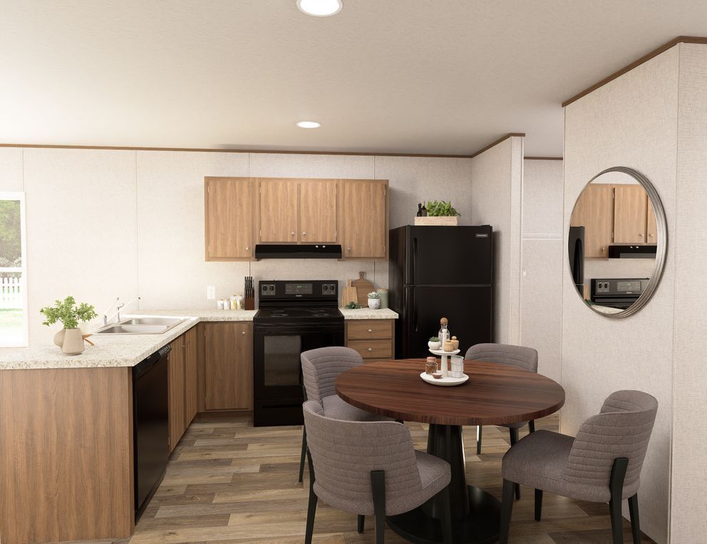 Modern kitchen and dining area with white cabinets, wood accents, round table, and gray chairs