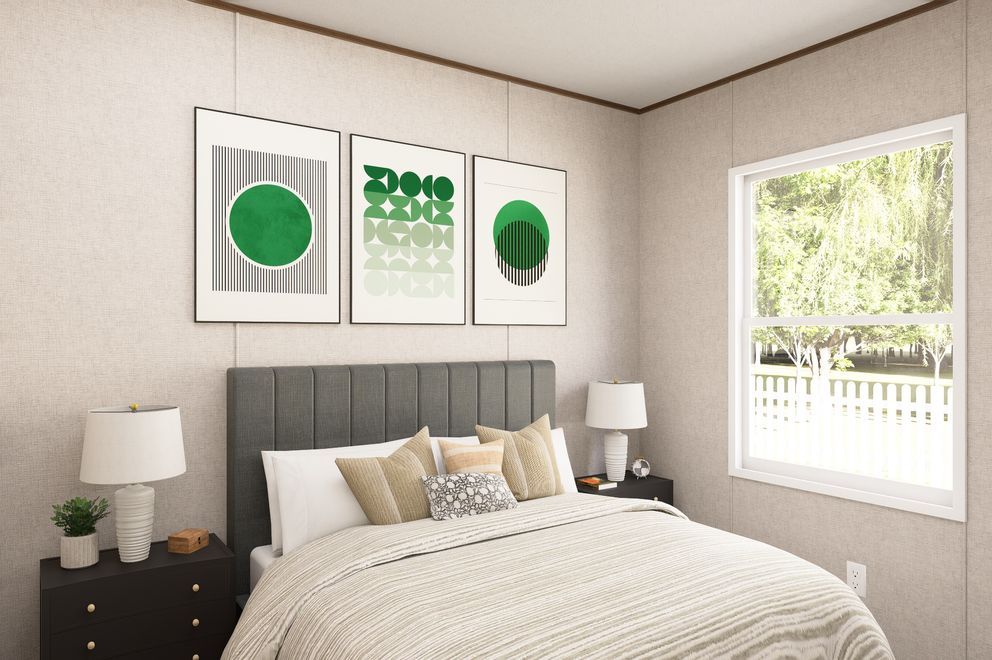Cozy bedroom with beige walls, striped bed, black nightstands, and green geometric wall art
