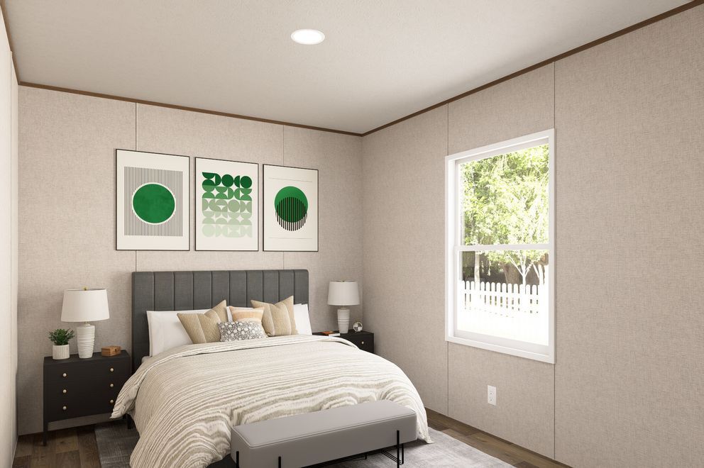 Bright bedroom with gray bed, black nightstands, green wall art, and sunlight through a window.