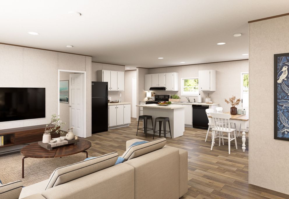 Modern open-plan living room and kitchen with beige sectional, island stools, and white dining table