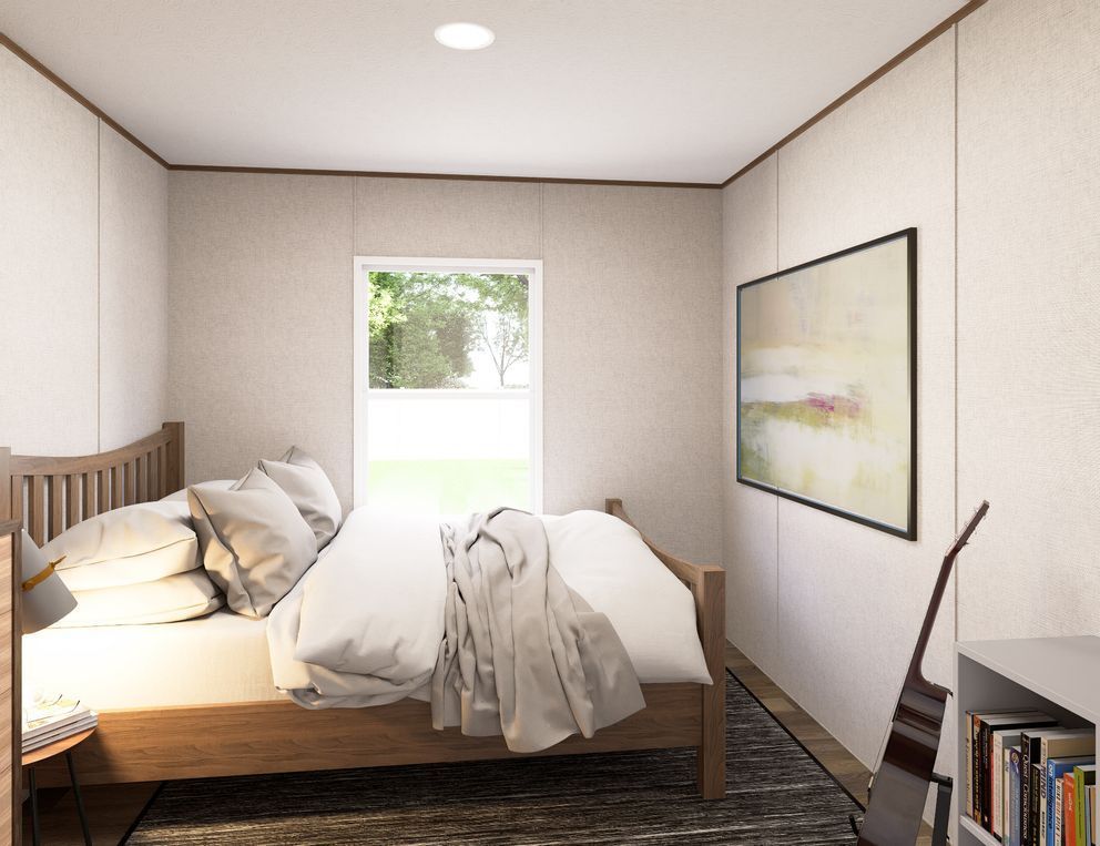 Bright bedroom with unmade bed, window, wall art, and bookshelf in a minimalist interior