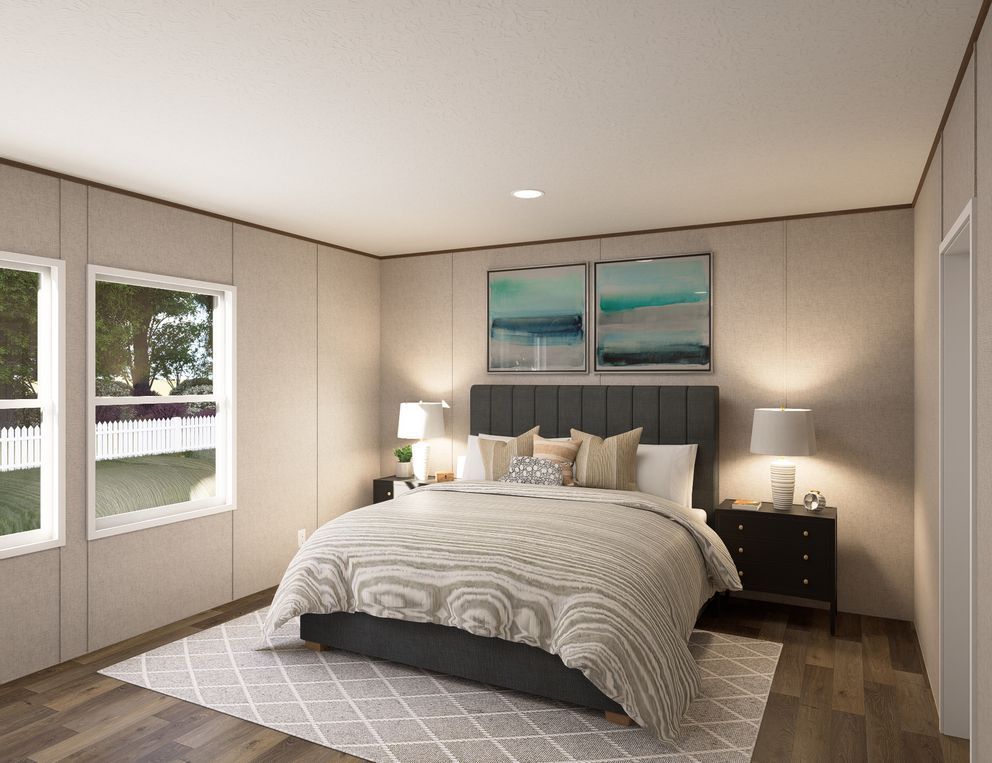 Modern bedroom with a bed, bedside lamps, large windows, and neutral decor