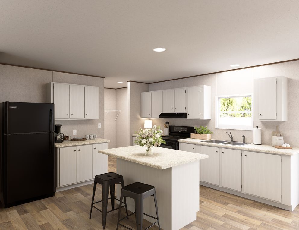 Bright modern kitchen with white cabinets, black fridge, central island, and stools.