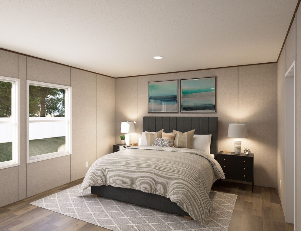 Modern bedroom with a bed, nightstands, lamps, and large windows in neutral tones