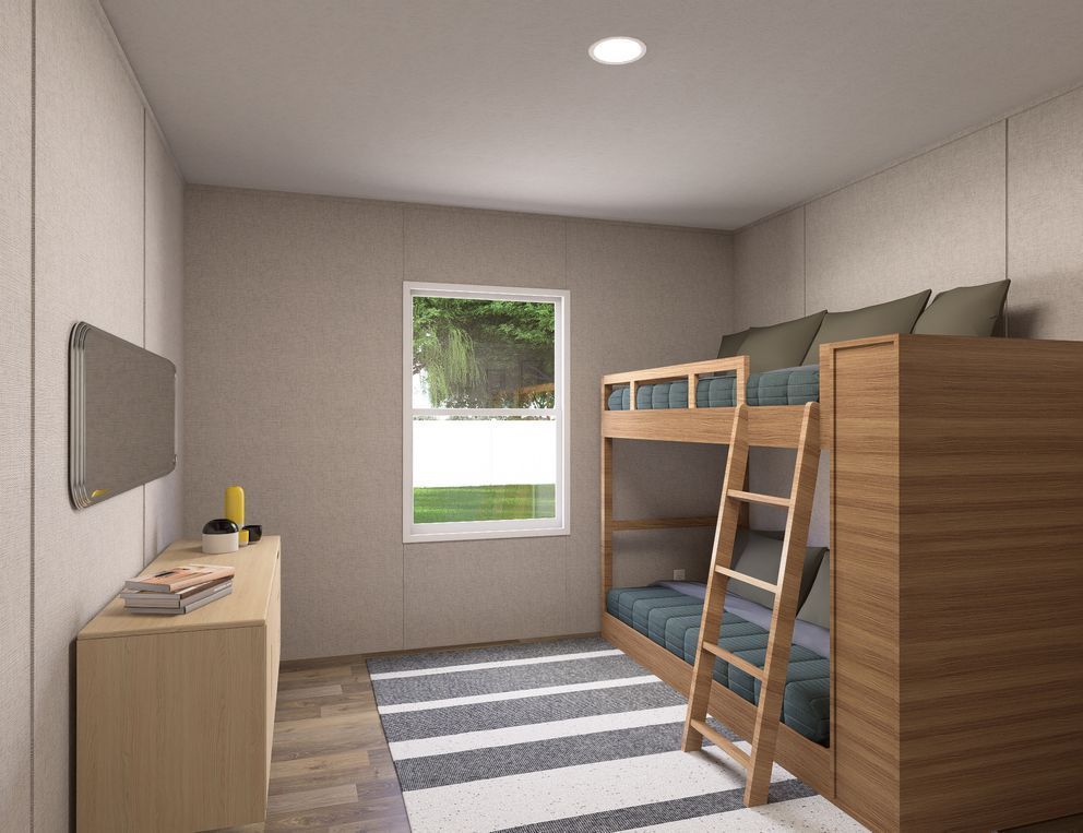 Small bedroom with bunk bed, desk, striped rug, and a window letting in daylight