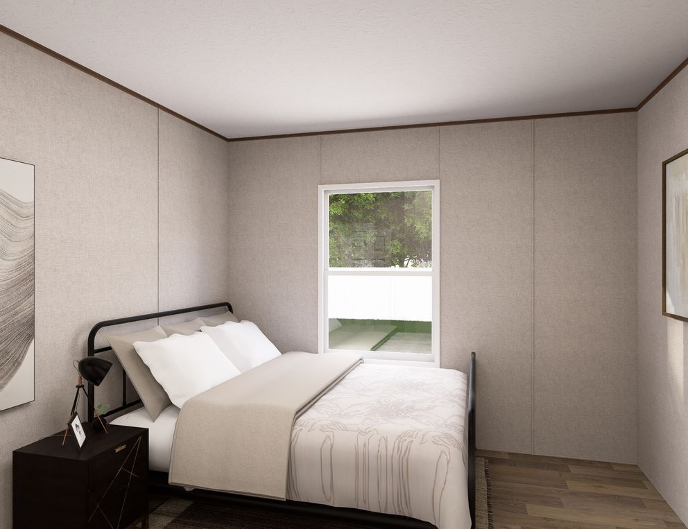 Small bedroom with a bed, nightstand, window, and framed wall art.