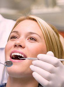 Woman having dental check up