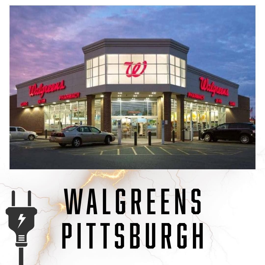 Walgreens store exterior in Pittsburgh, PA, at dusk with lit windows, red signage, and parked cars.