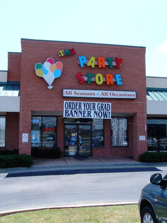 A party store with a sign that says order your grad banner now