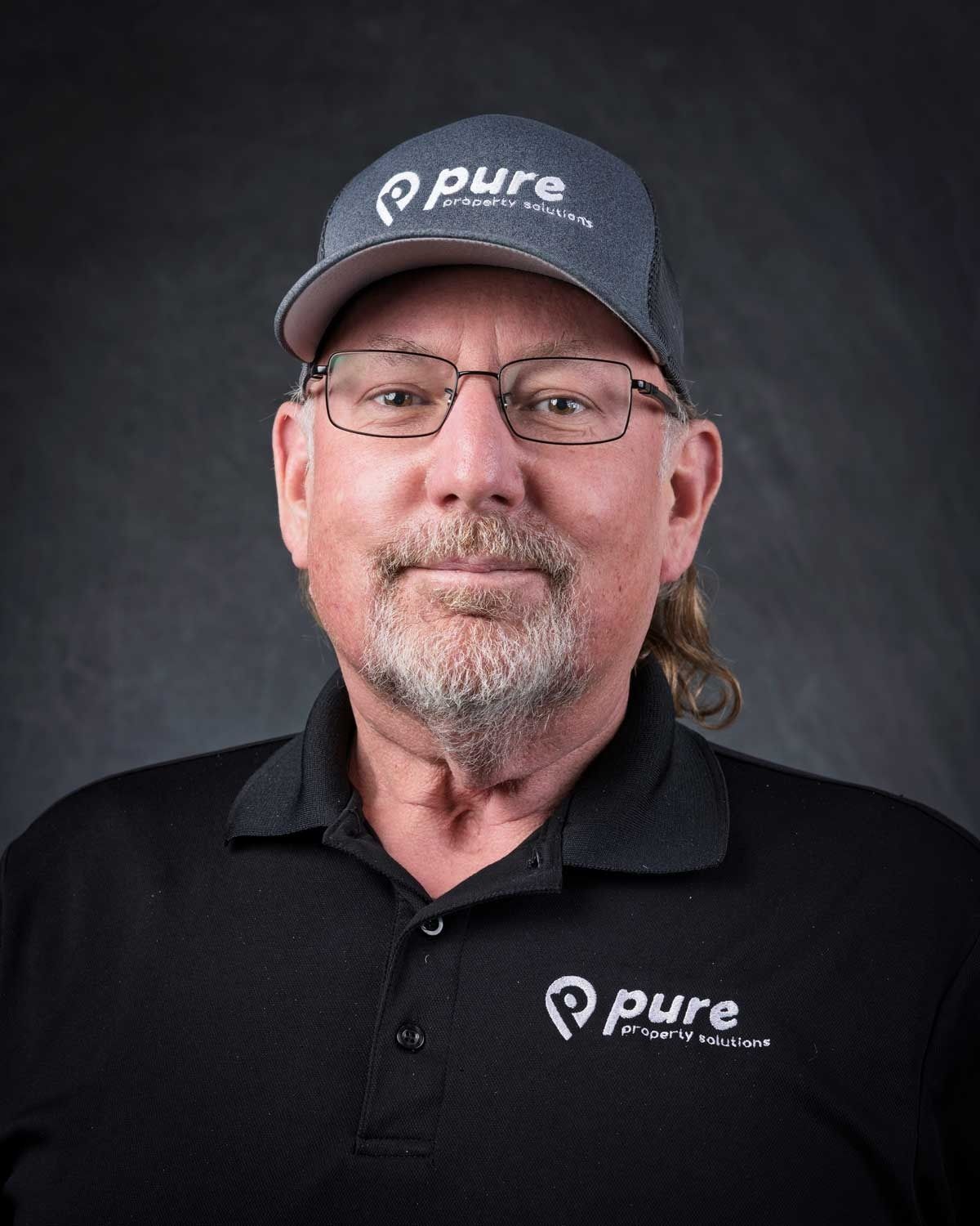 Man wearing a hat and glasses with the 