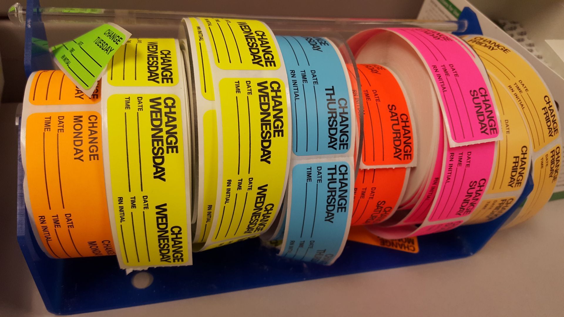Several rolls of change labels are stacked on top of each other