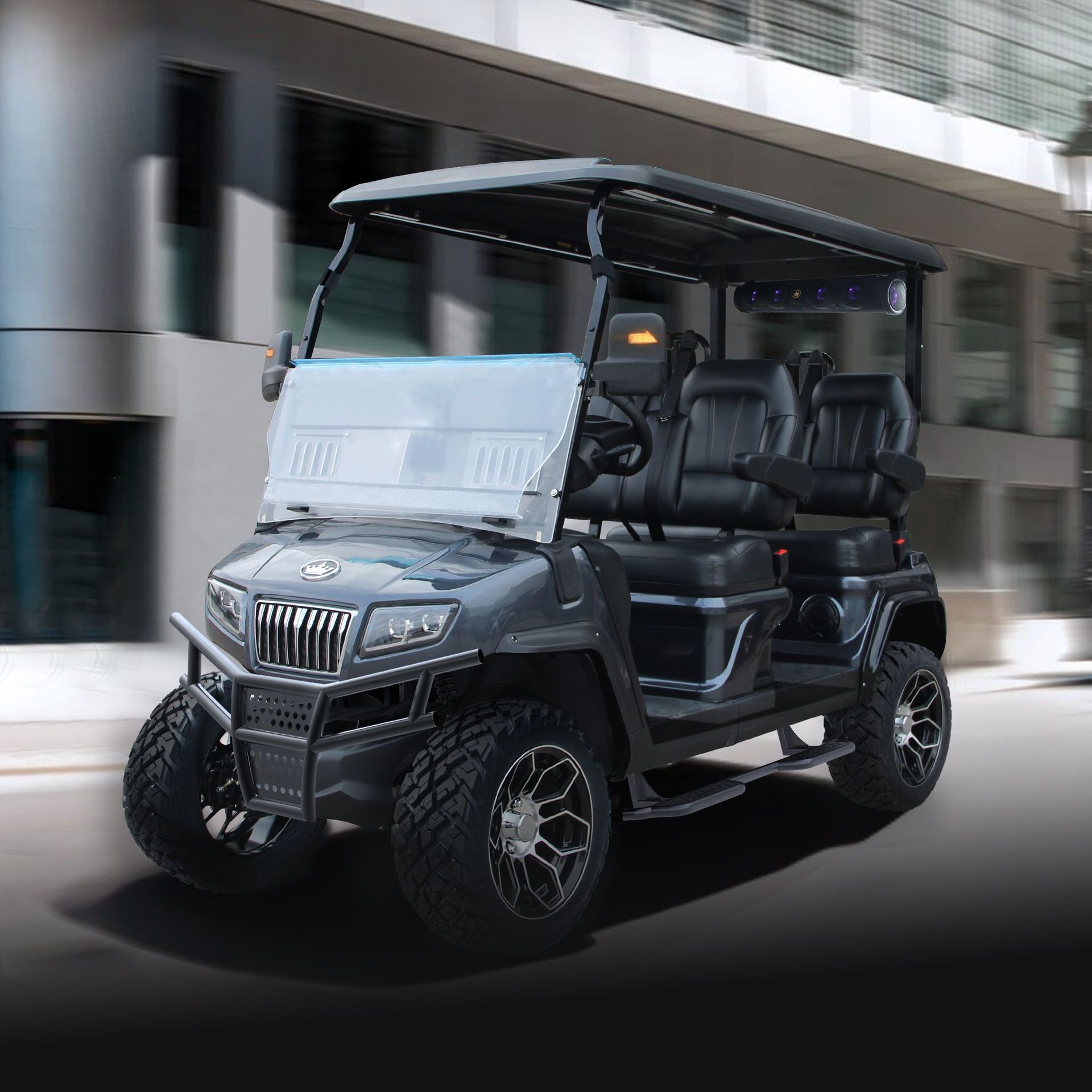 A black golf cart is parked in front of a building.