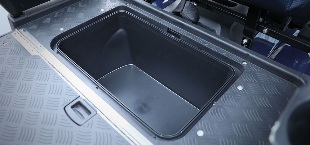 A black container is sitting on top of a black table.