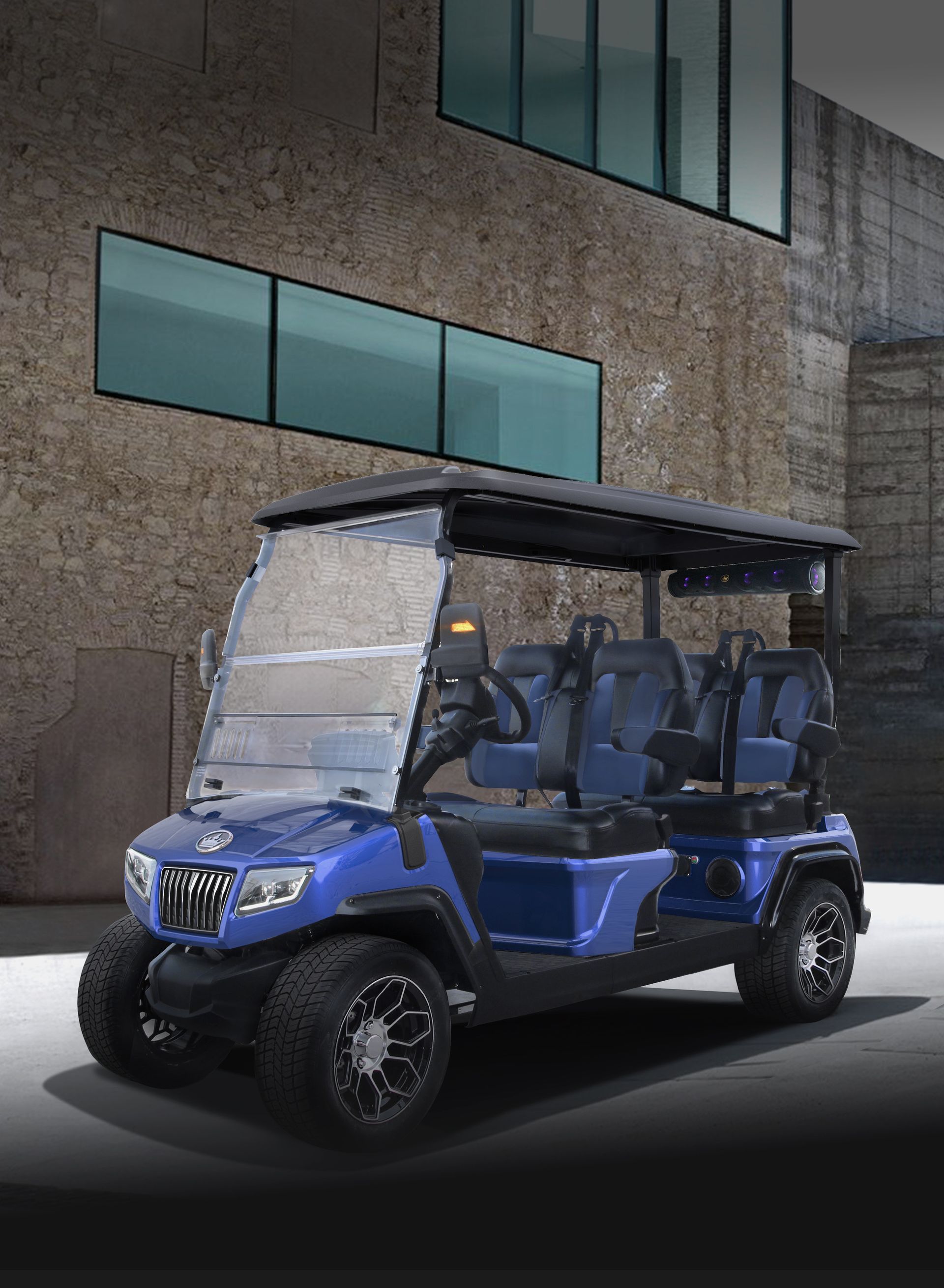 A blue golf cart is parked in front of a building.