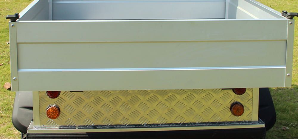 The inside of a golf cart with a steering wheel