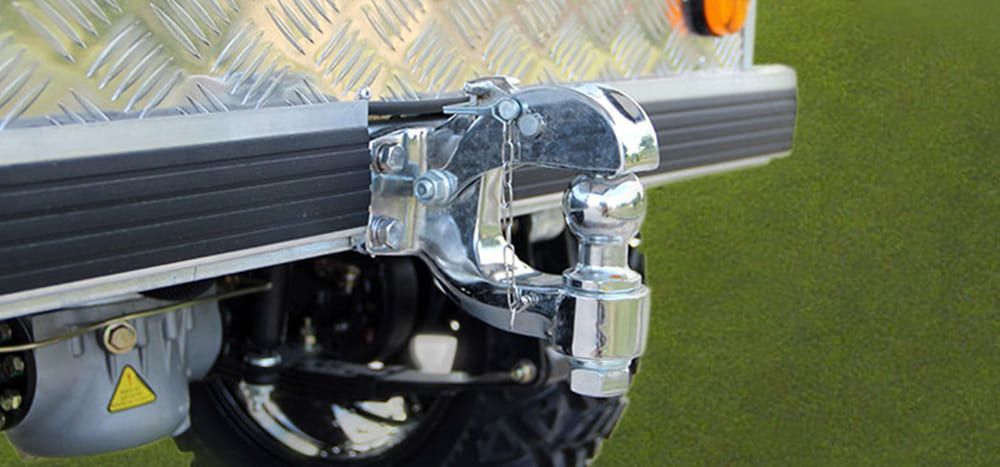 A close up of a steering wheel and dashboard of a car.