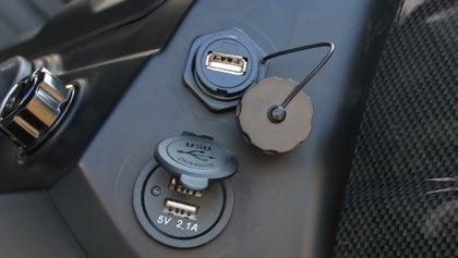 There are two usb ports on the side of a car.