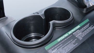 A close up of a cup holder on a golf cart.